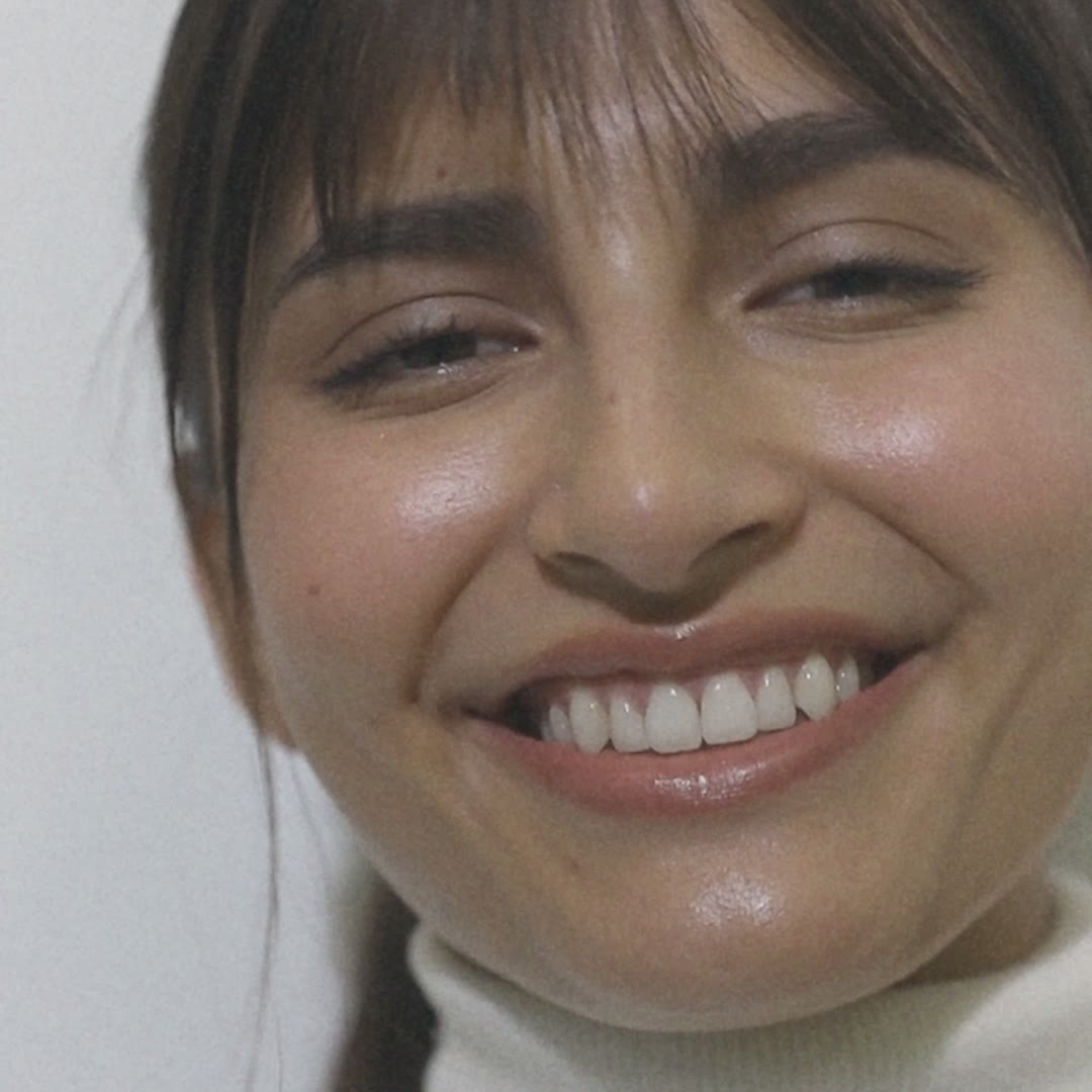 Paciente sonriendo en la clínica